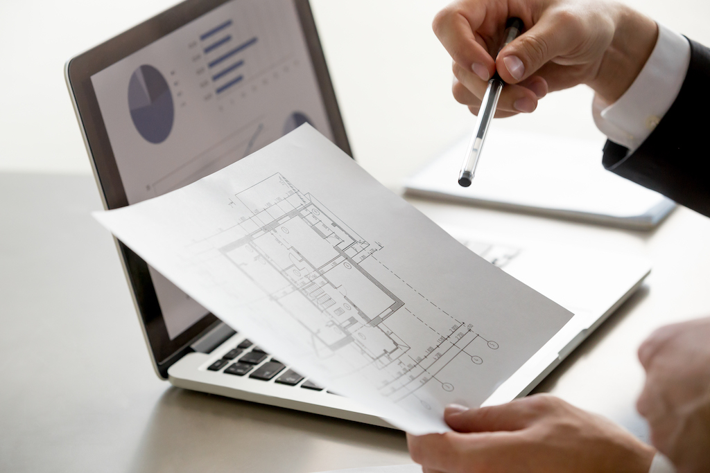 Image showing floor plan in front of notebook